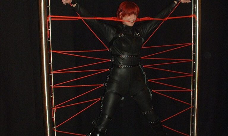 Rubber Slave Melanie in a Spider Web