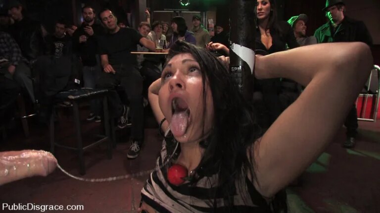 Beautiful brunnette, Jade Indica, is bound and fucked in a crowded bar