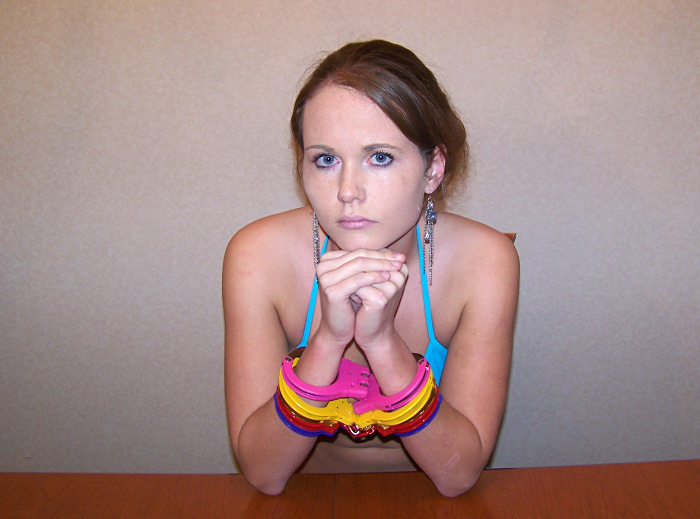 Gigi in colored handcuffs