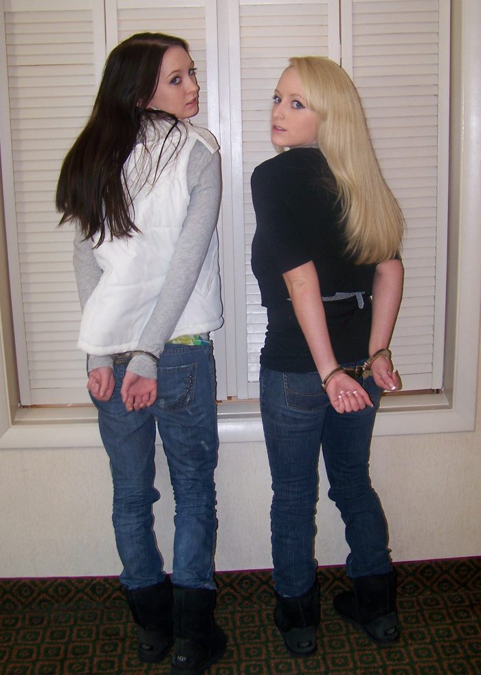 Christina and Olivia in hinged cuffs