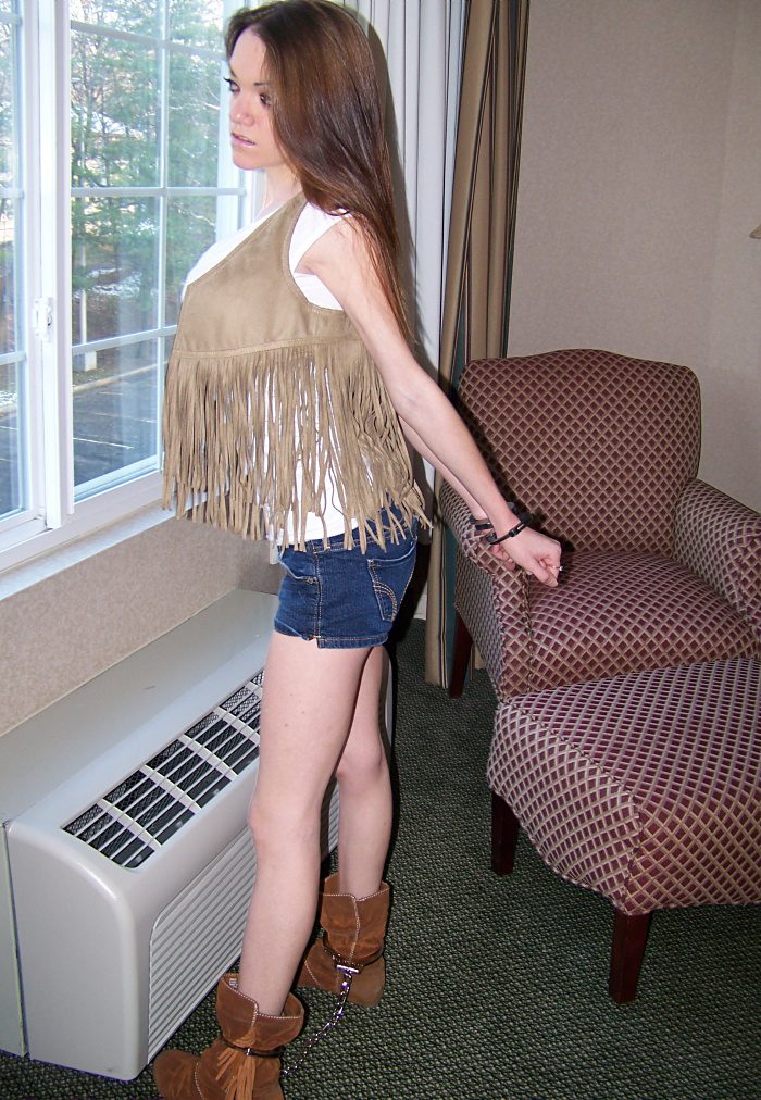Emily in cuffs and leg irons