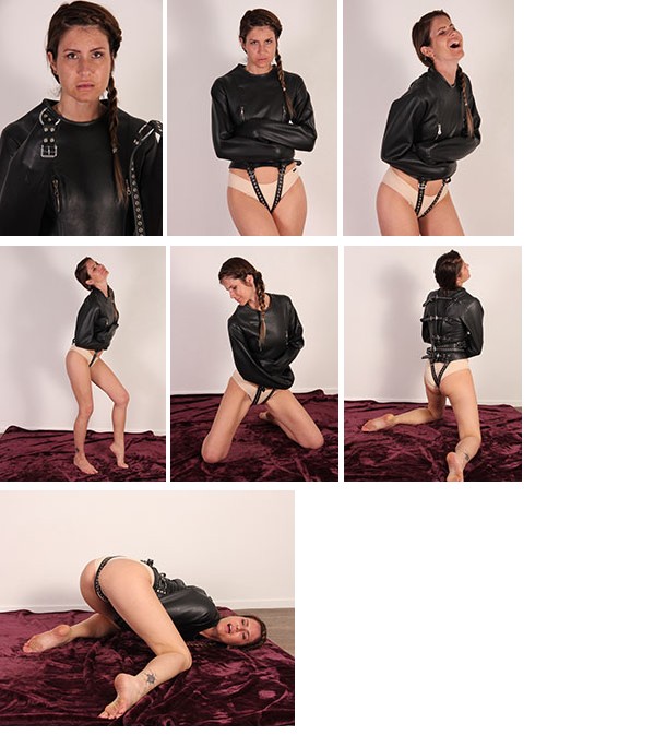 Lili in a black leather straitjacket