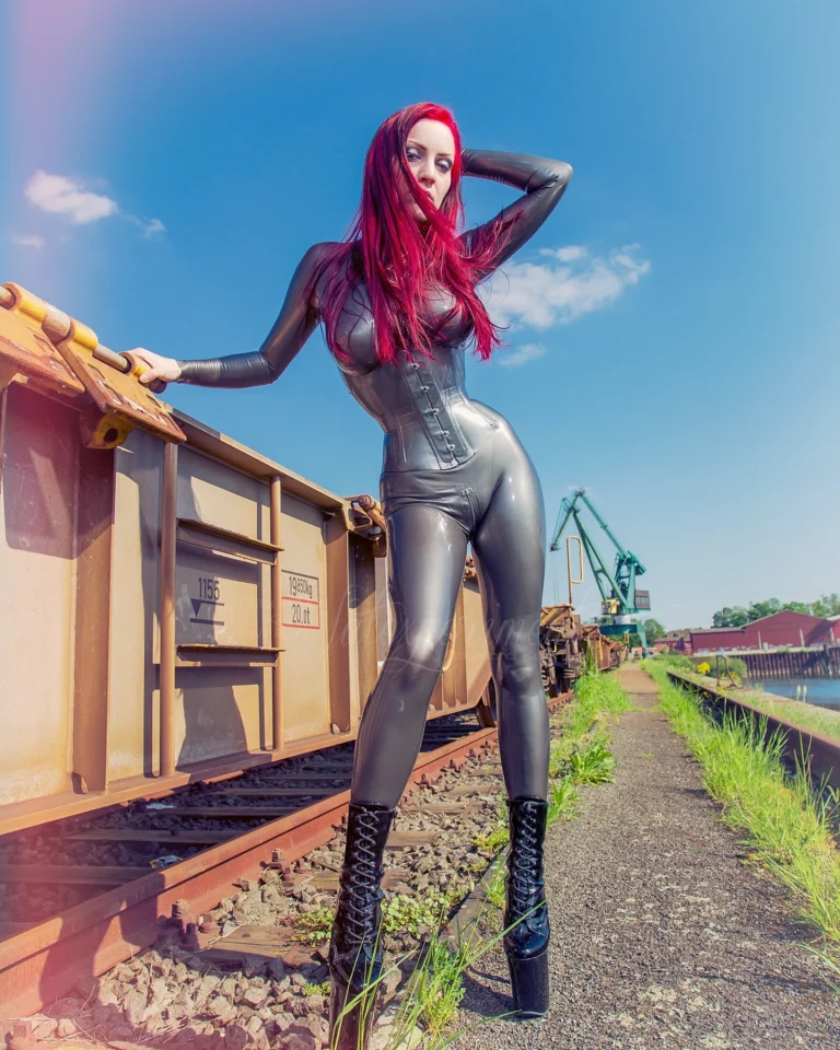 Shiny Red Head at the Train