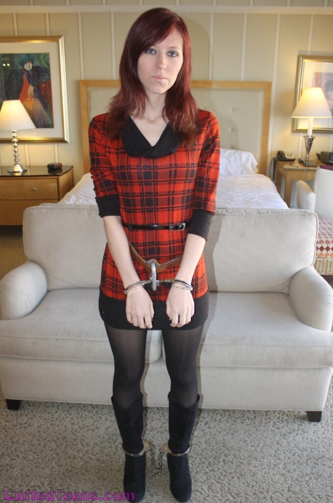 Holly Ann in a leather prison belt