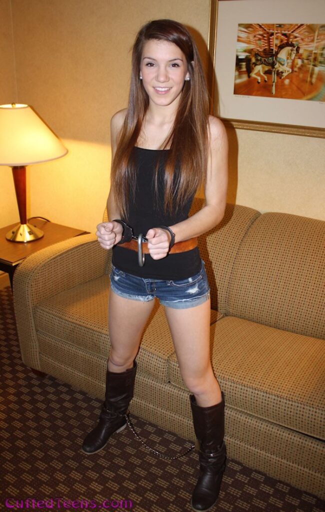 Rae in her prison belt